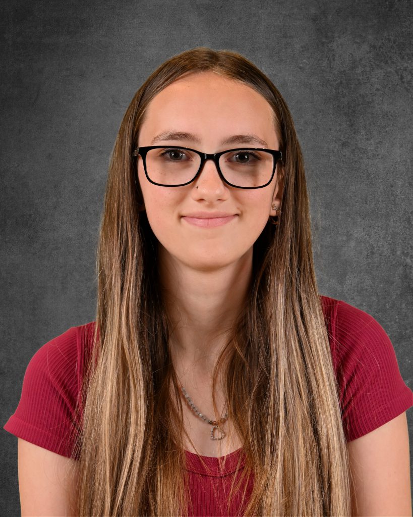 student, ariel pope, posing for student picture day, smiling