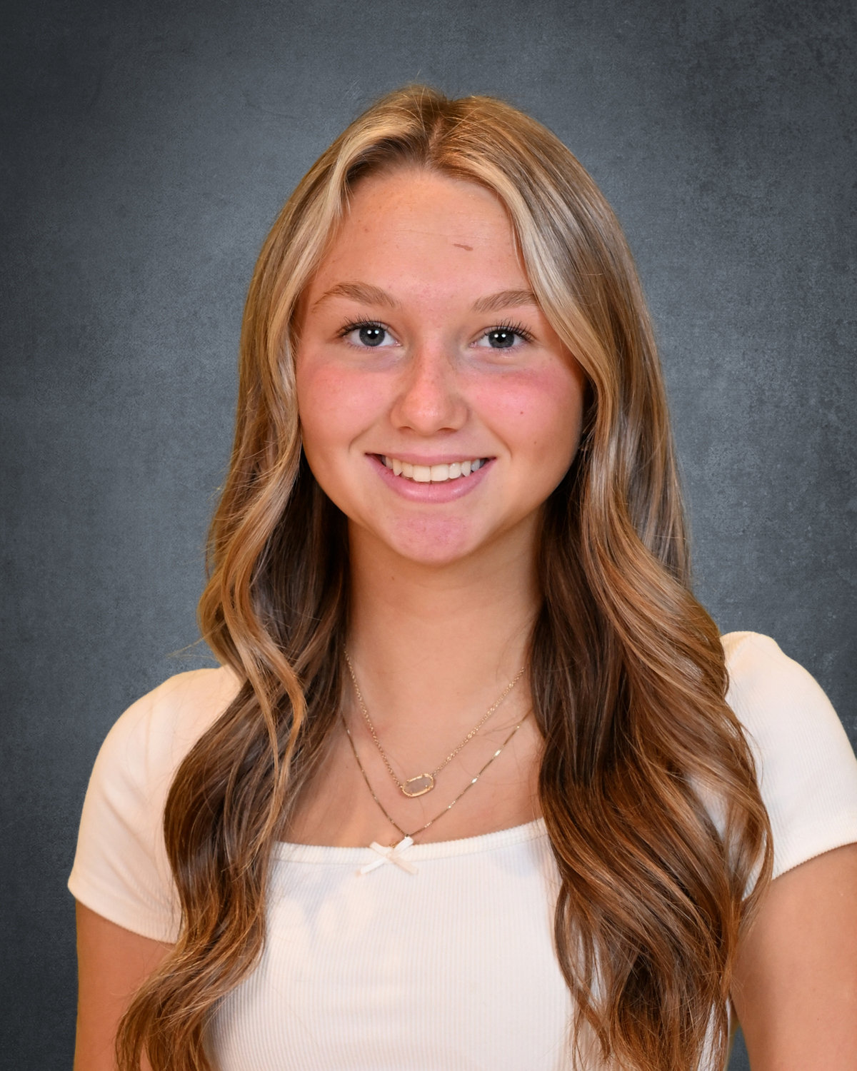 student posing for camera for school picture day