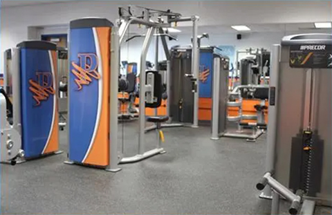 interior of fitness center featuring stationary exercise equipment.