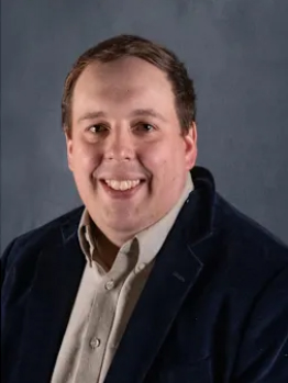 headshot of Aaron Chrisman.