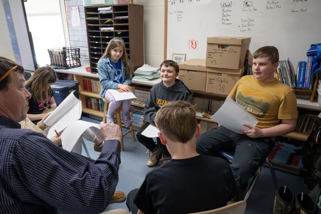 Teacher reading off list to students