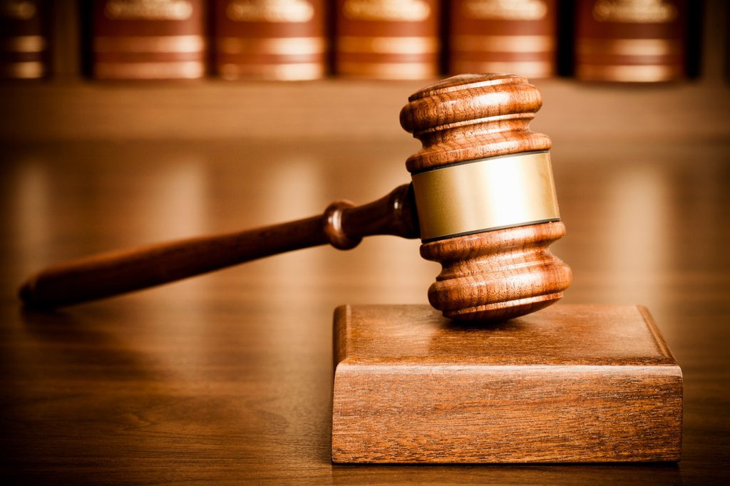 Gavel on wood block.
